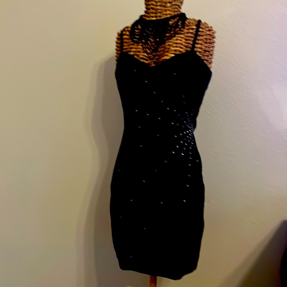 Wilson’s black suede cocktail dress with bib beaded necklace